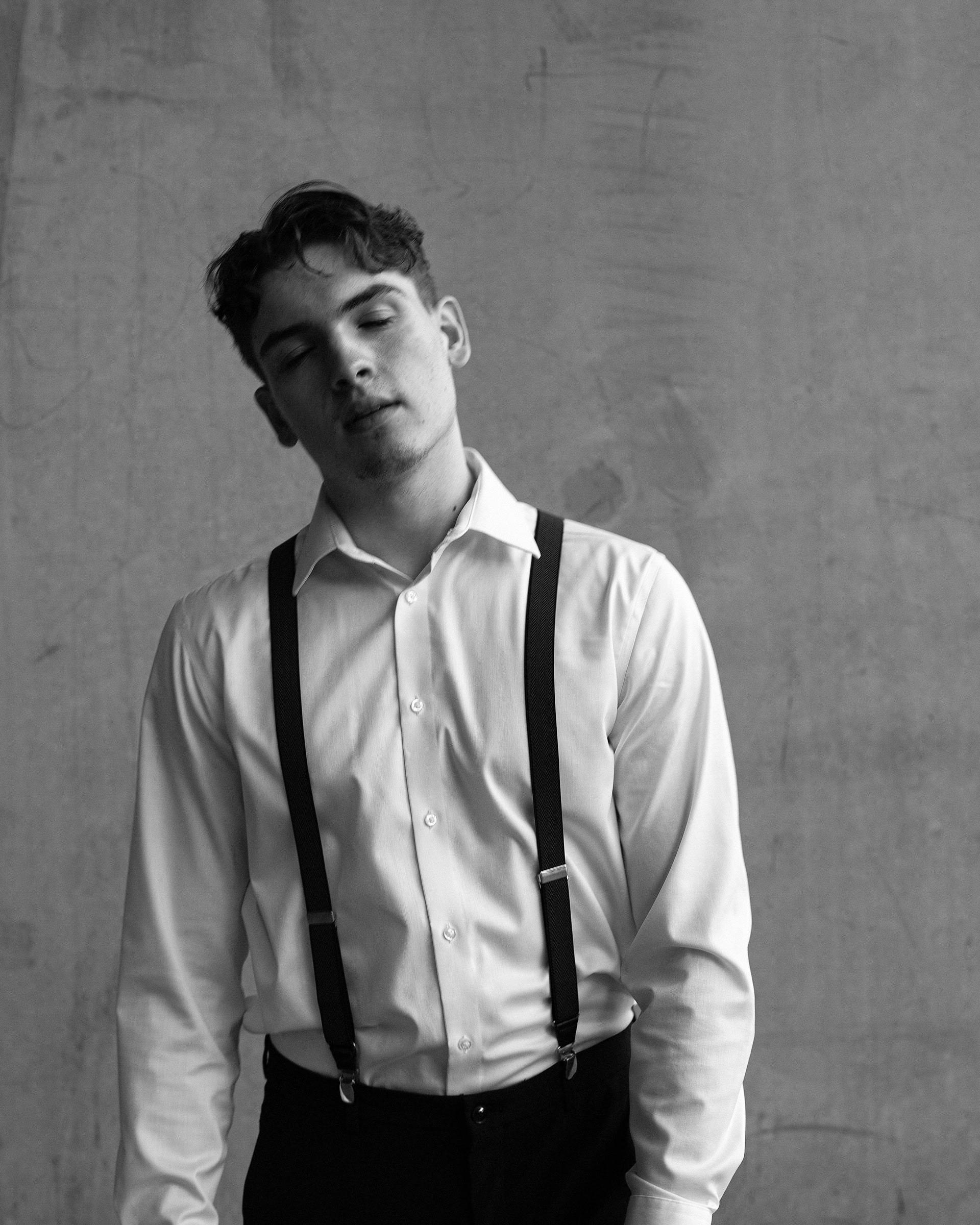 Man with eyes closed, head tilted