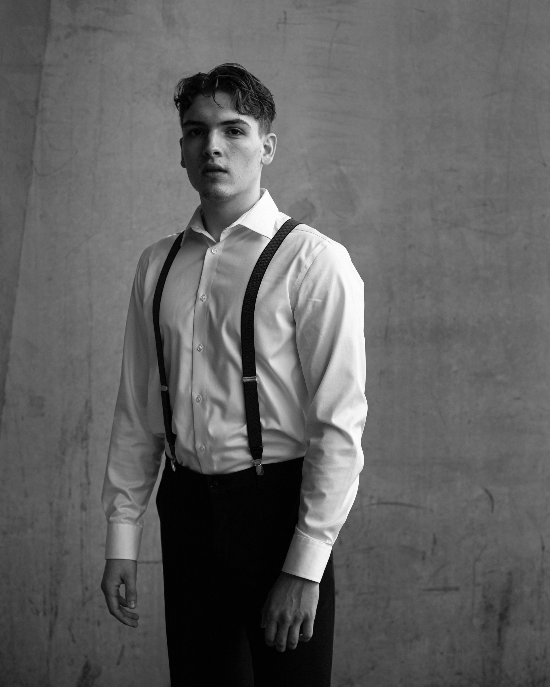 Man standing upright, direct gaze