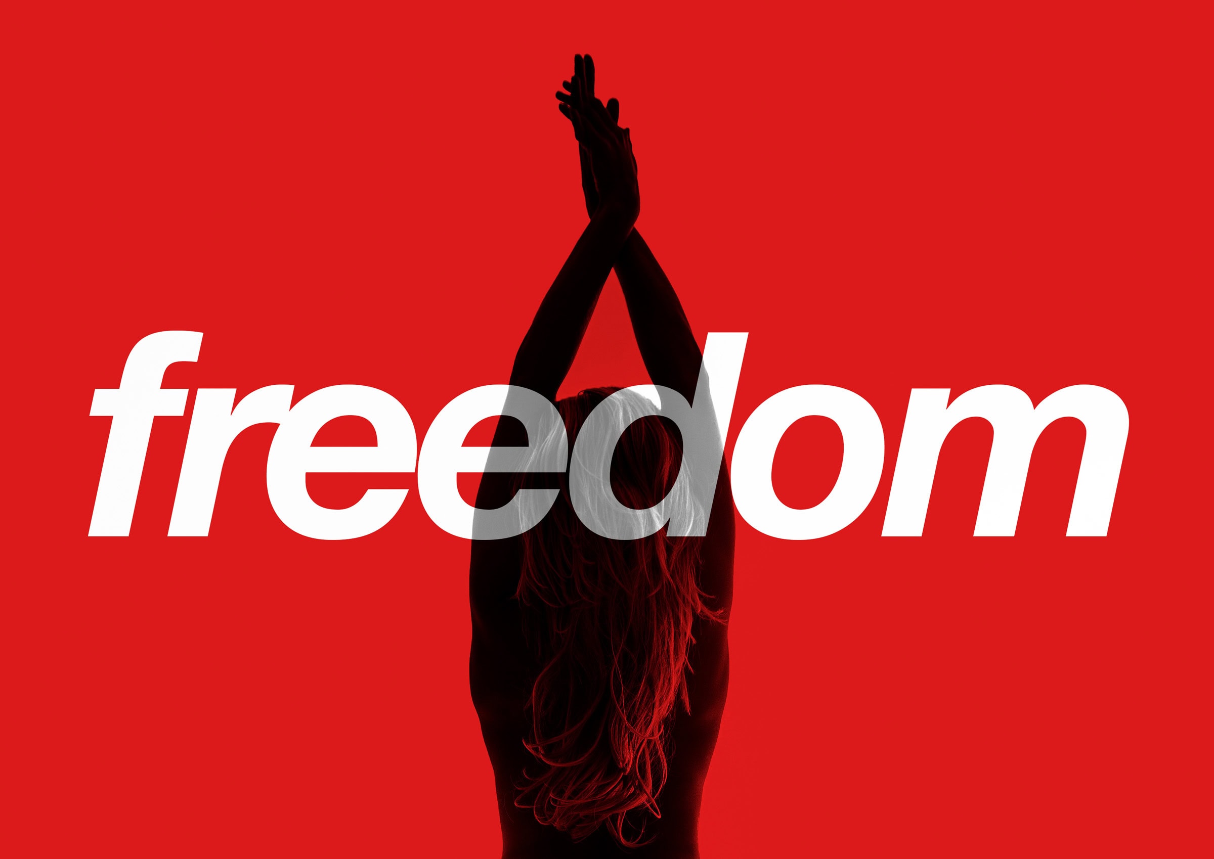 Figure with arms raised on red beneath the word freedom