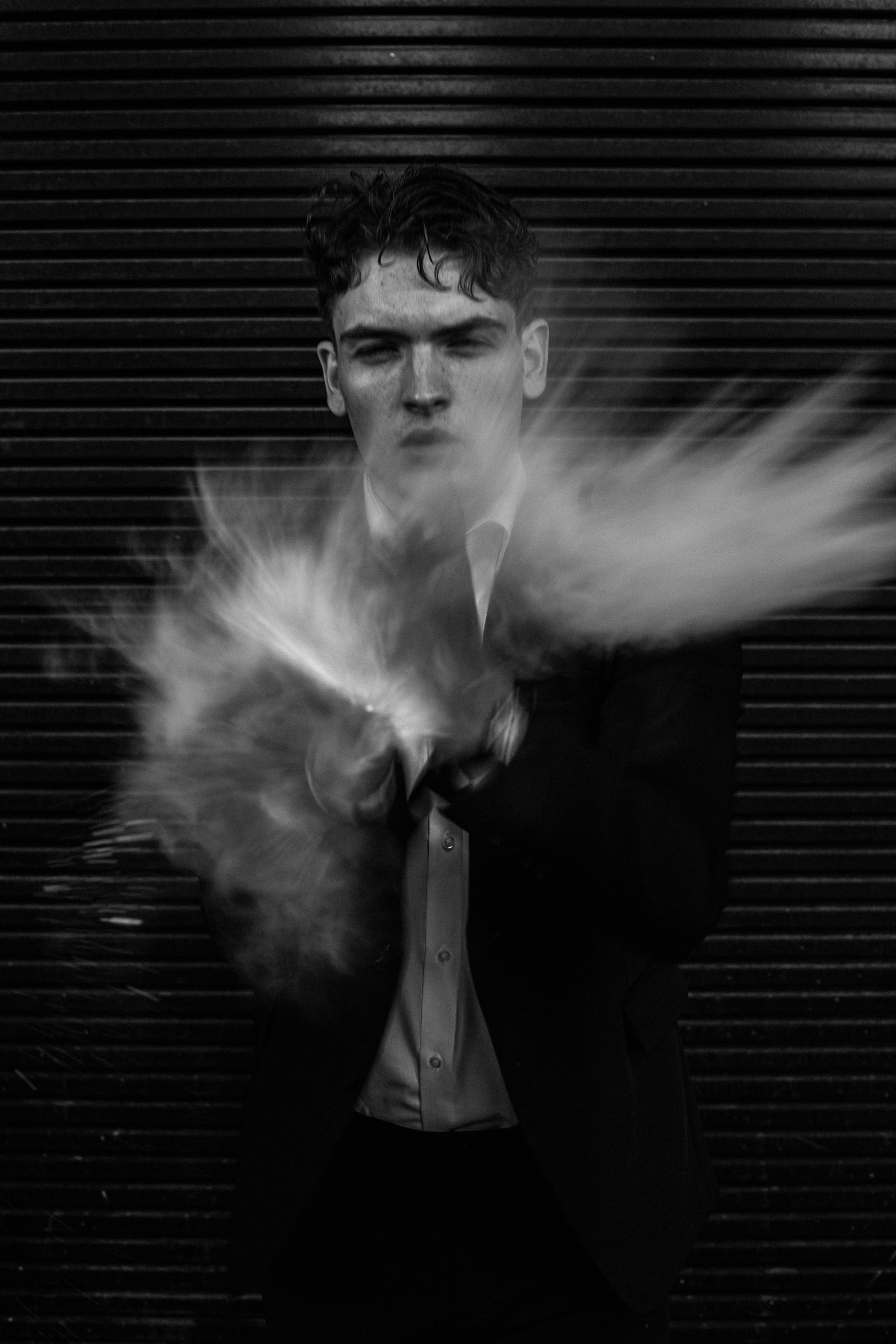 White powder exploding against a suited figure