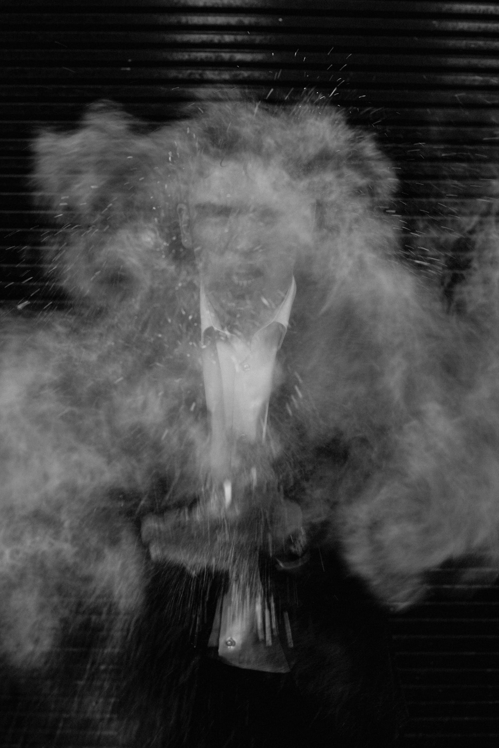 A larger cloud of powder engulfing the figure